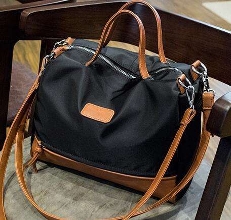 Nylon Oxford fabric strong and wild matches handbag. Brown and black color. Stock in ZA