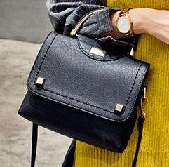 Fashion hard leather ladies leisure handbag, with strap. Black. Stock in ZA