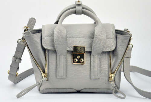 Genuine leather philip cambridge satchel style flip handbag. Grey color.