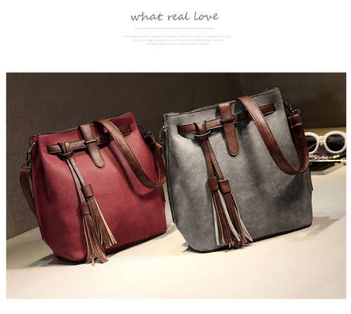 Fashion bucket ladies bag with tassels. Grey color. Stock in ZA.