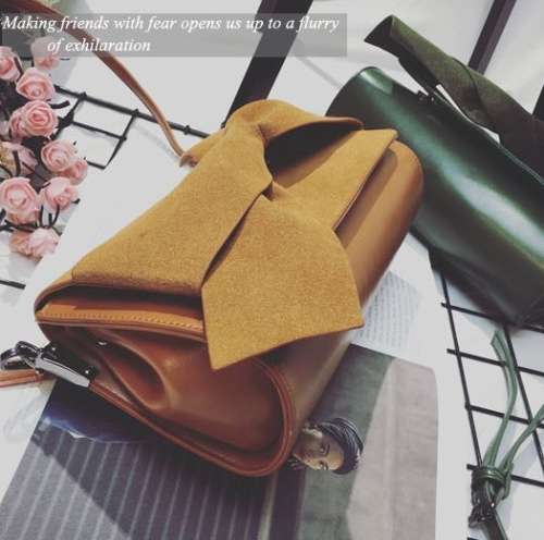 Nubuck bowknot clutch. Brown color. Stock in ZA.