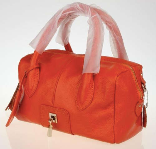 Genuine leather motor style handbag. Orange color. Clearance.