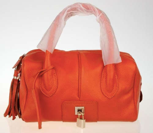 Genuine leather motor style handbag. Orange color. Clearance.