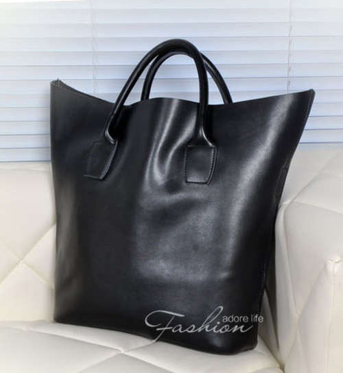 Famous design genuine leather handbag. Black color. Stock in ZA