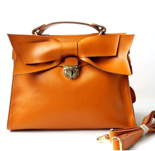 Genuine leather classic bow style ladies handbag with belt. Stock in ZA