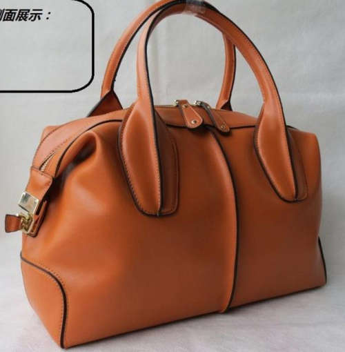 Genuine leather stars love famous design ladies handnag. brown-orange color. Stock in ZA