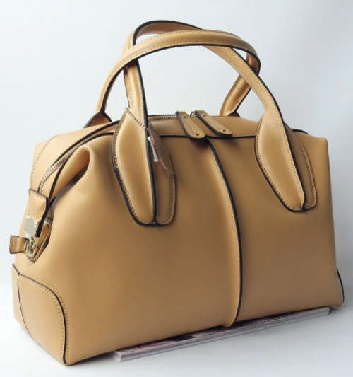 Genuine leather stars love famous design ladies handnag. apricot color. Stock in ZA