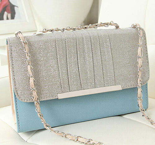 Shining retro ladies handbag with chains. Blue color. Stock in ZA