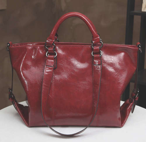 Waxy look motorcycle large capacity handbag. Wine red color. In my own stock