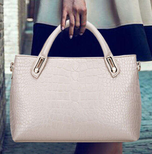 Crocodile pattern wild use ladies handbag with strape. Rice color. In my own stock