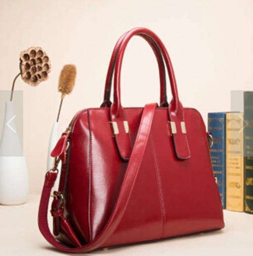 Noble style ladies large handbag with strape. Maroon bcolor. Stock in ZA
