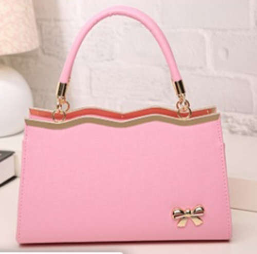 Beautiful and fashion bow ladies handbag, light pink color. Stock in ZA