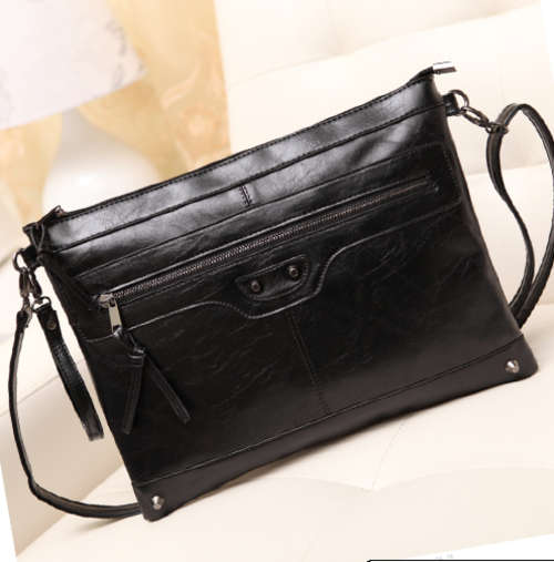 Motor style ladies black handbag with strape. Stock in ZA