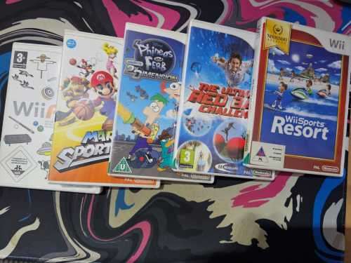 Wii + limited Mario cart racing game and x3 remotes + 6 games note Mario cart disc is in console