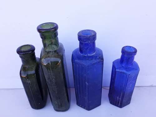 Two blue and two green NOT TO BE TAKEN bottles