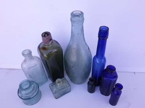 Collection of 9 antique bottles