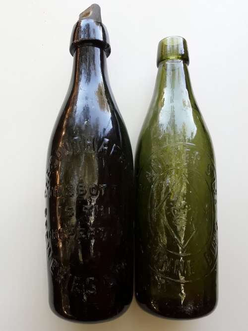 Two antique beer bottles SA BREWERIES and CHANDLER'S
