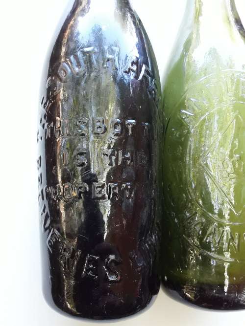 Two antique beer bottles SA BREWERIES and CHANDLER'S