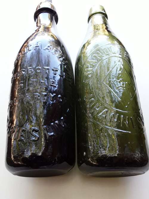 Two antique beer bottles SA BREWERIES and CHANDLER'S