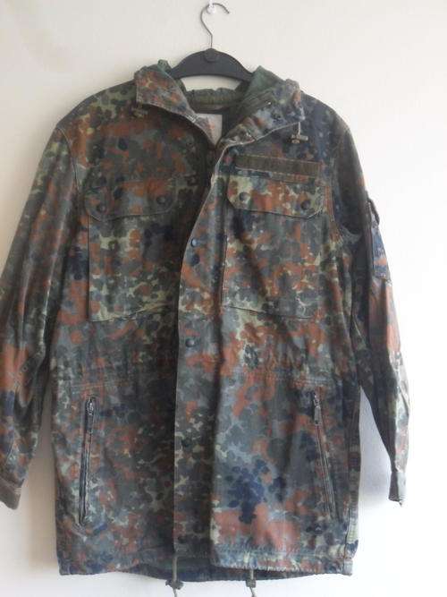 German camo jacket with hoodie. Velcro name tag. Size Large. Good condition.