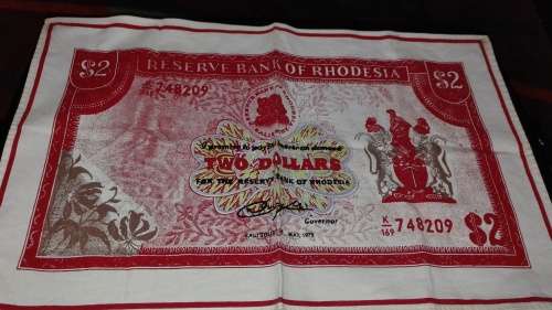 A really nice item a Rhodesia print on cloth of the old 2 $ note