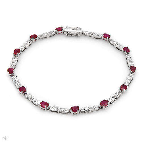 TENNIS BRACELET WITH NATURAL EYE CLEAN DIAMONDS AND RUBYS IN 10K WHITE GOLD.