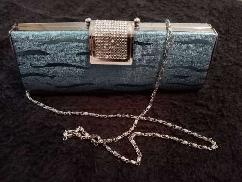 Light blue glitter clutch bag as new