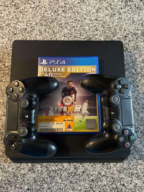 PLAYSTATION 4 SLIM 500GB  WITH 2 GAMES and 2 CONTROLLERS