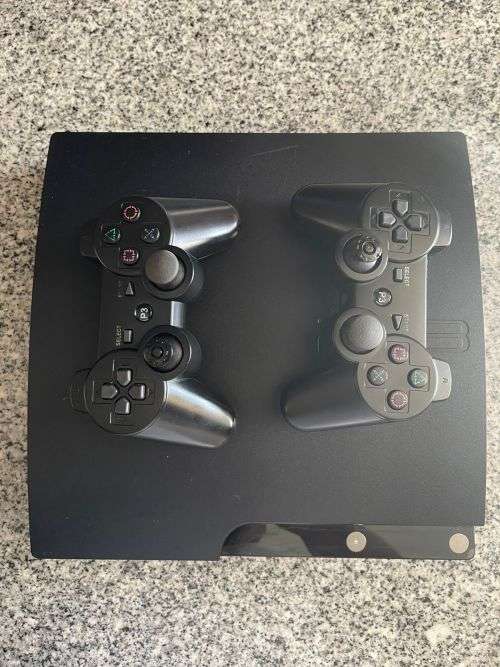 SONY PLAYSTATION 3 40GB WITH 2 CONTROLLERS and 4 GAMES