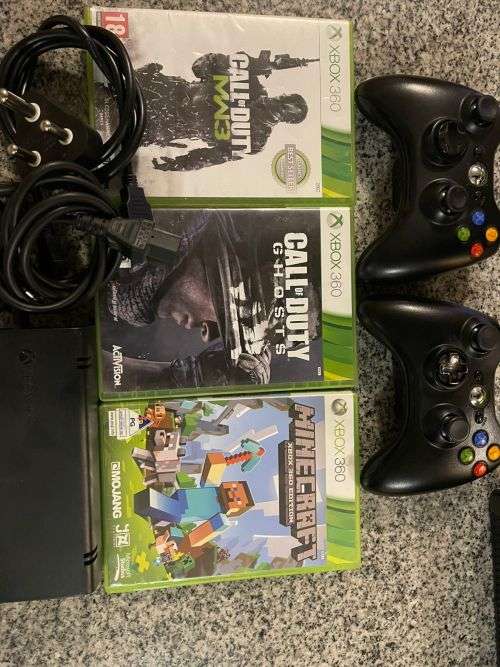 X BOX 360 E 4GB WITH 2 CONTROLLERS ,  and 3 GAMES