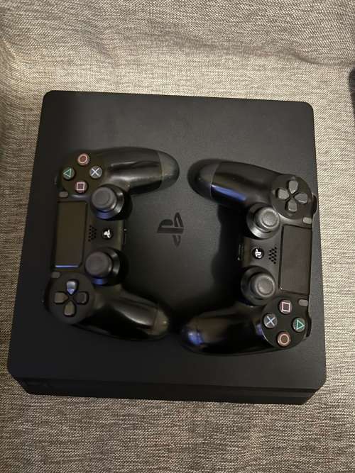 PLAYSTATION 4 SLIM 1TB WITH 8 GAMES and 2 CONTROLLERS