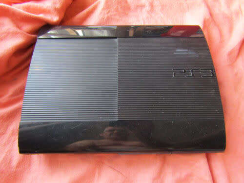 PS3 SUPER SLIM 500GB HDD WITH 45 GAMES AND TWO CONTROLLERS