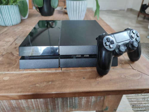 1TB PS4 FAT GEN WITH TWO ORIGINAL CONTROLLERS AND 10 GAMES