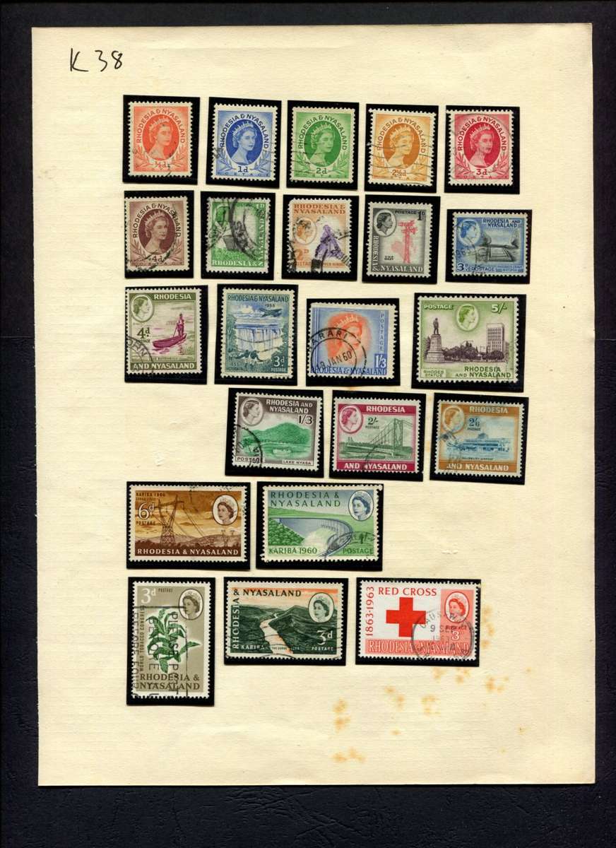 Rhodesia and Nyasaland - 22 Stamps Mounted (Hinged) On Album Page