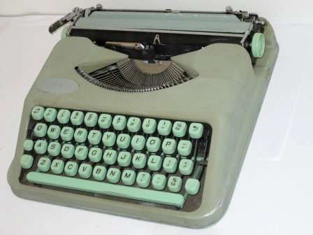 Retro Hermes Baby typewriter with case