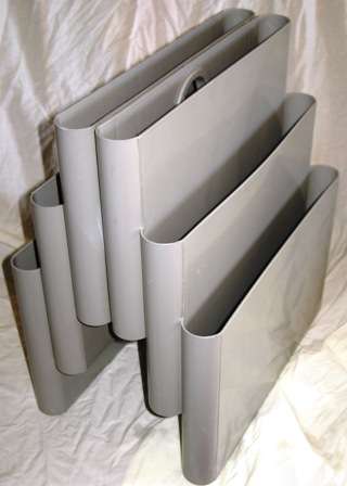 AN ABS PLASTIC MAGAZINE RACK DESIGNED BY GIOTTO STOPPINO FOR KARTELL, ITALY, 1972