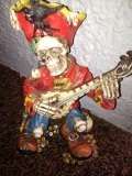 CERAMIC FIGURINE SKULL WITH GUITAR
