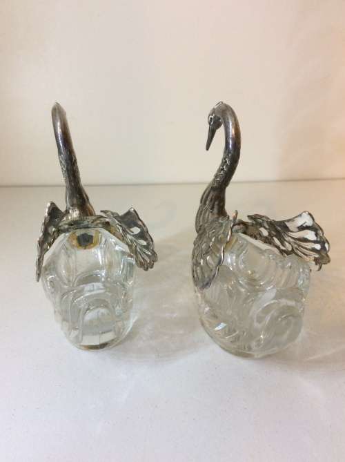 TWO GLASS AND WHITE METAL SWAN RING OR SALT HOLDERS - GREAT DETAIL - 8cm HIGH -