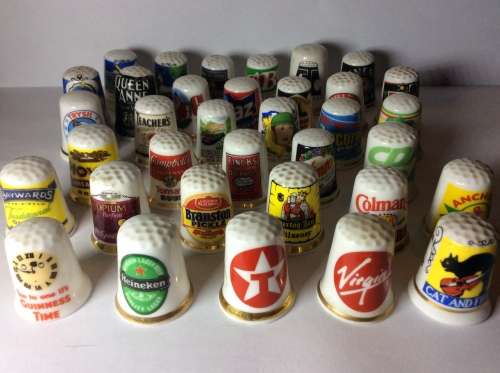35 CERAMIC THIMBLES WITH GREAT SUBJECT MATTER - BID PER THIMBLE TO TAKE ALL 35 -