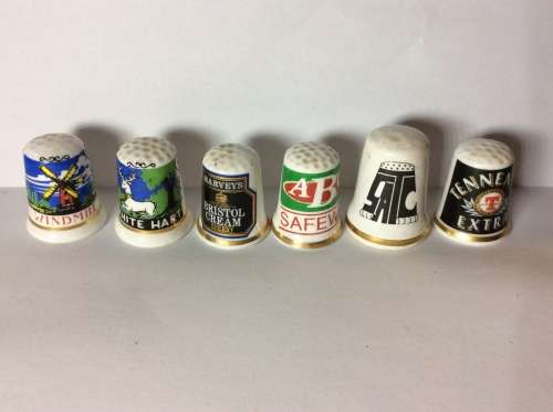 35 CERAMIC THIMBLES WITH GREAT SUBJECT MATTER - BID PER THIMBLE TO TAKE ALL 35 -