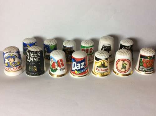 35 CERAMIC THIMBLES WITH GREAT SUBJECT MATTER - BID PER THIMBLE TO TAKE ALL 35 -
