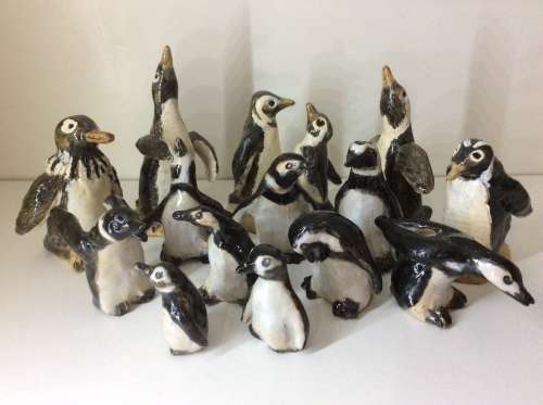 COLLECTION OF 14 PENGUINS - FIRE GLAZED HAND MADE POTTERY - ARTWORK - ALL FOR ONE BID -
