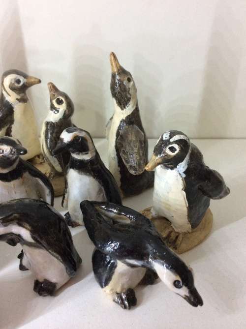 COLLECTION OF 14 PENGUINS - FIRE GLAZED HAND MADE POTTERY - ARTWORK - ALL FOR ONE BID -