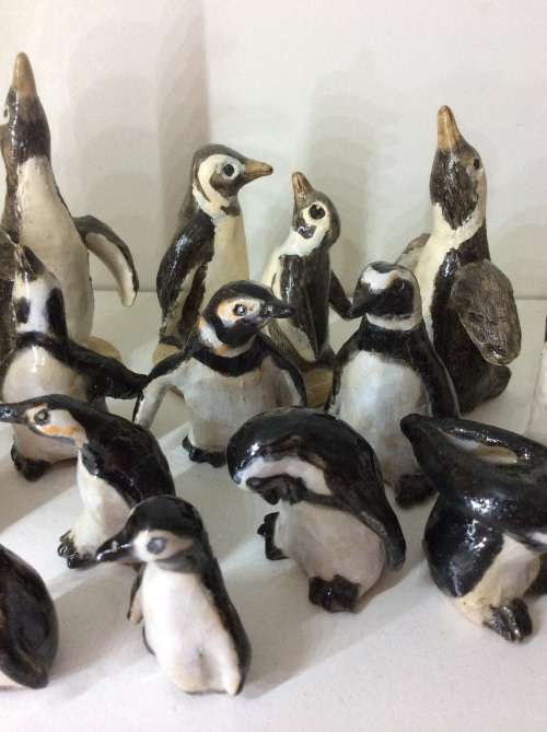 COLLECTION OF 14 PENGUINS - FIRE GLAZED HAND MADE POTTERY - ARTWORK - ALL FOR ONE BID -