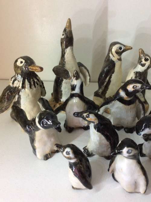 COLLECTION OF 14 PENGUINS - FIRE GLAZED HAND MADE POTTERY - ARTWORK - ALL FOR ONE BID -
