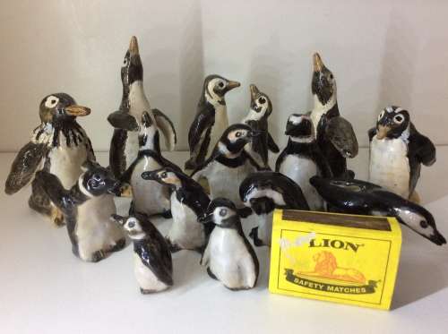 COLLECTION OF 14 PENGUINS - FIRE GLAZED HAND MADE POTTERY - ARTWORK - ALL FOR ONE BID -