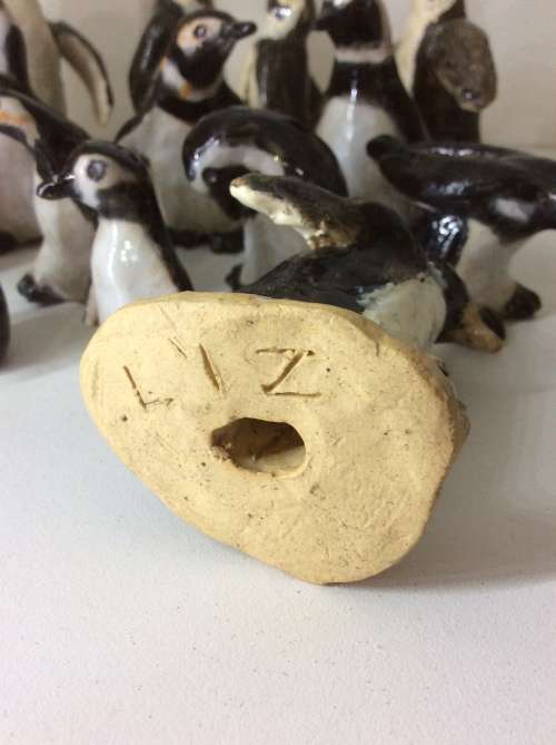 COLLECTION OF 14 PENGUINS - FIRE GLAZED HAND MADE POTTERY - ARTWORK - ALL FOR ONE BID -