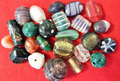 +- 24 assorted fancy glass beads
