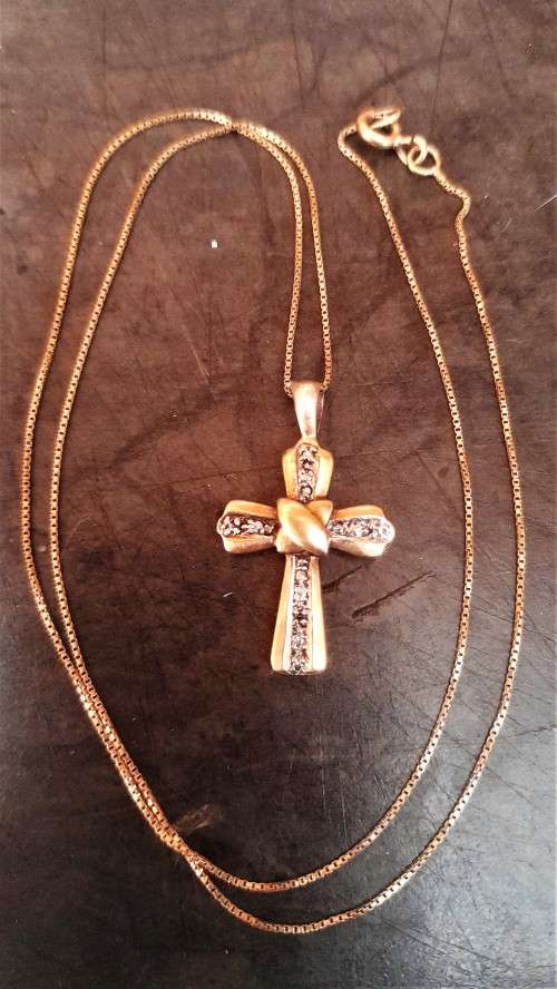 Lovely 9 Carat `Gold Cross and Chain` with small Diamond.