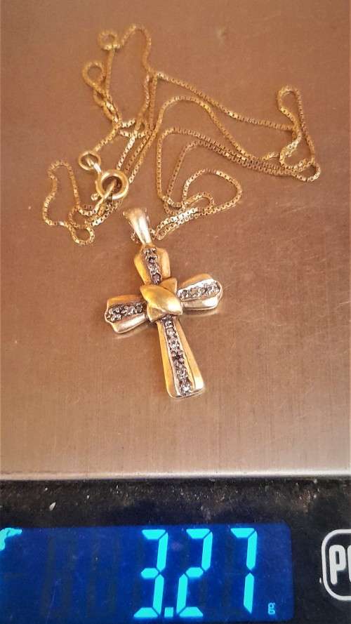 Lovely 9 Carat `Gold Cross and Chain` with small Diamond.